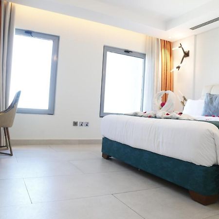 Waterfront Hotel Apartment Lusail Eksteriør bilde A room at the hotel