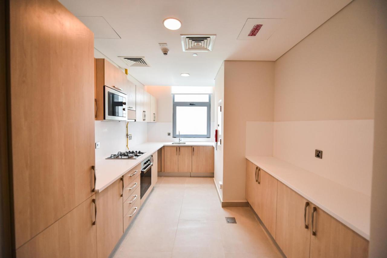 Waterfront Hotel Apartment Lusail Eksteriør bilde A typical kitchen in a student flat