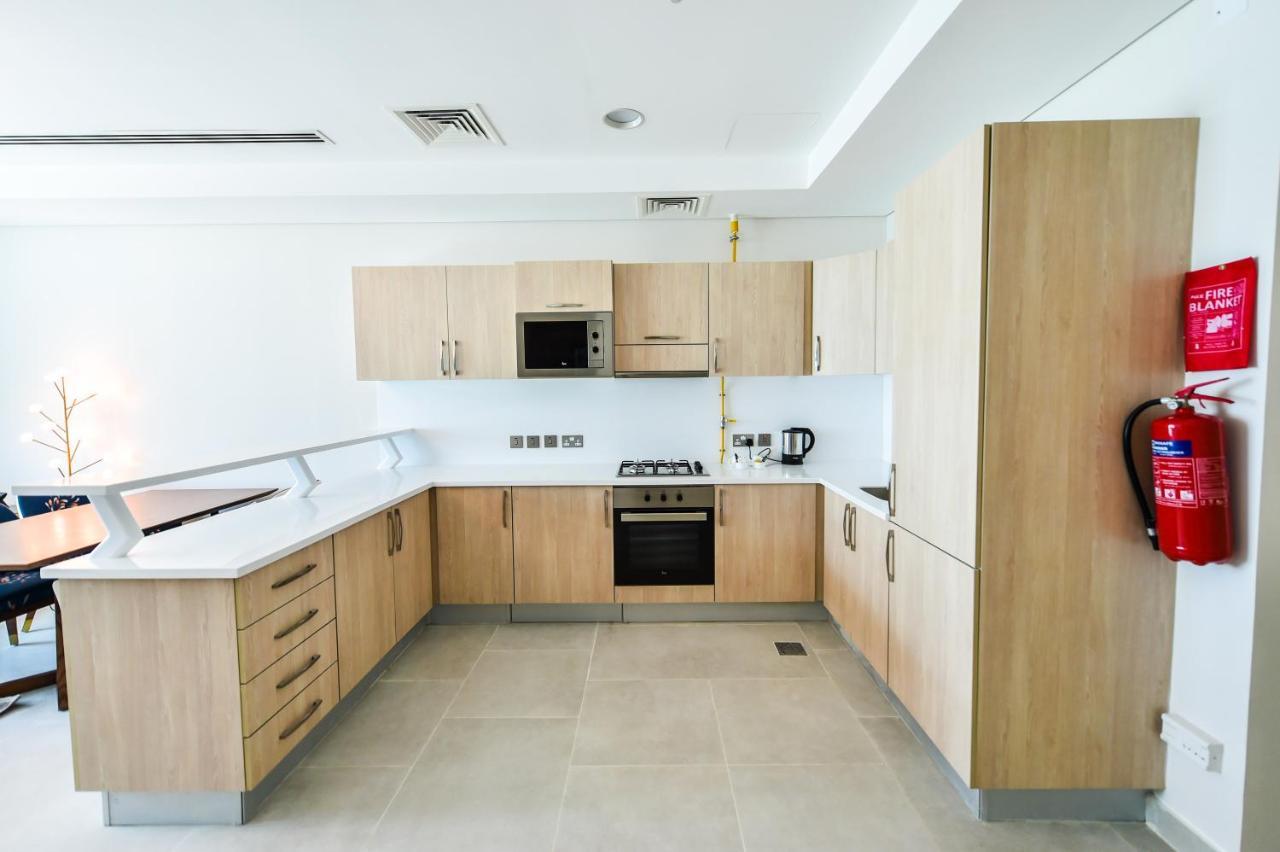 Waterfront Hotel Apartment Lusail Eksteriør bilde A typical kitchen in a student residence hall